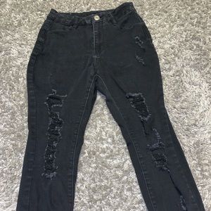 Worn some. Black ripped jeans.